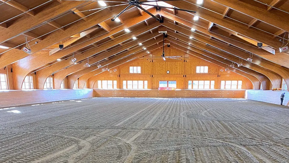 Glue laminated arch roof on indoor riding arena